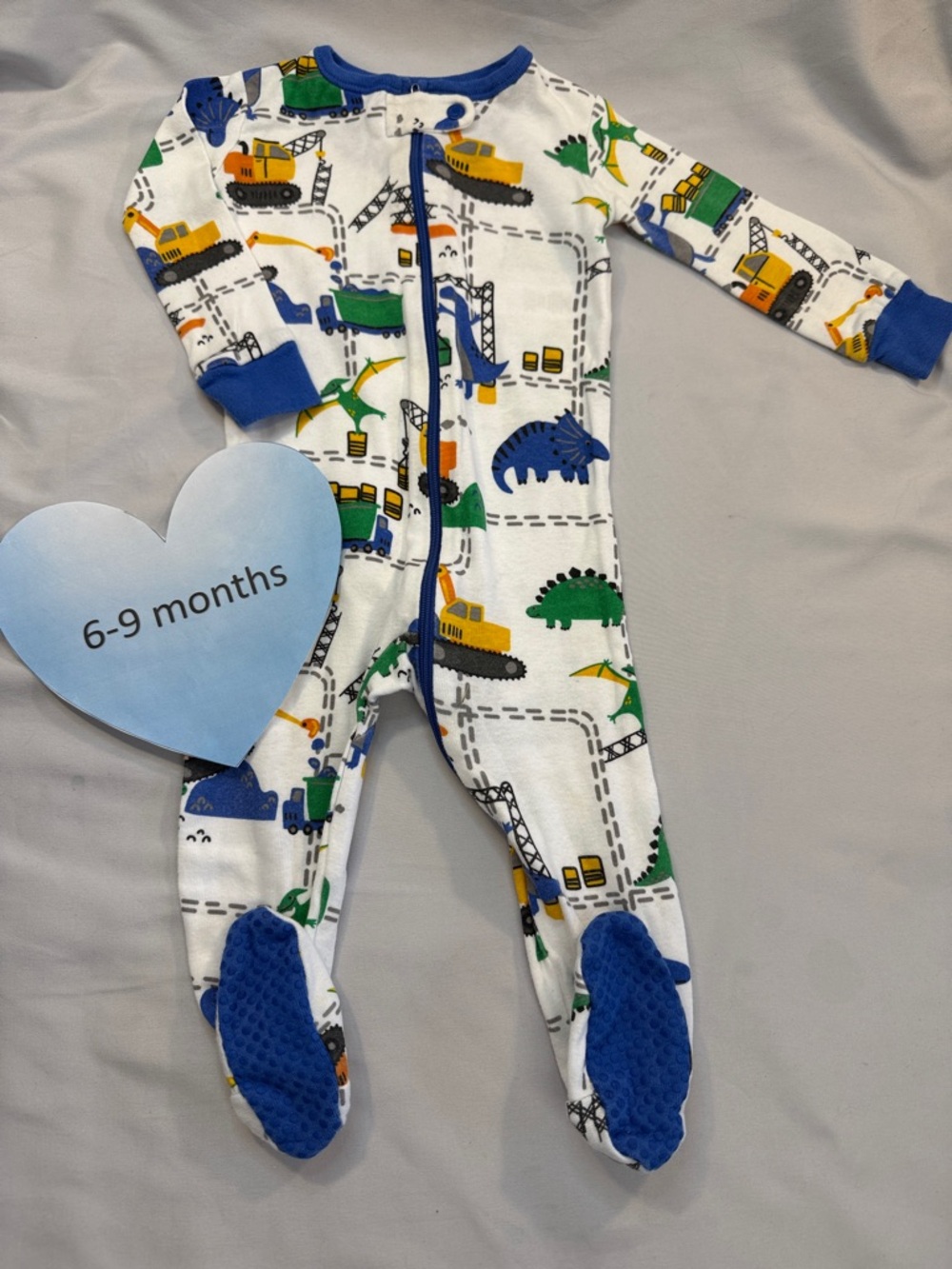 The Children’s Place Blue Trim White Baby One-Piece with Diggers & Dinosaurs